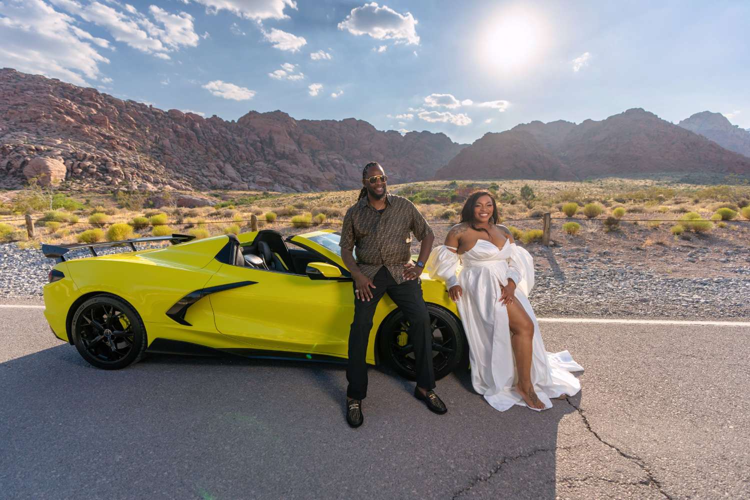 Couple with a yellow Corvette on a desert road outside Las Vegas, editorial couples photography