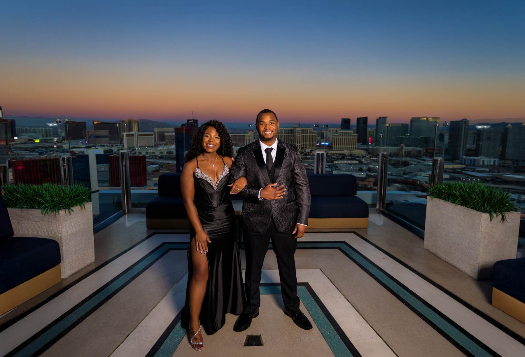 Couple on a rooftop terrace above the Las Vegas Strip at dusk, Las Vegas engagement photography